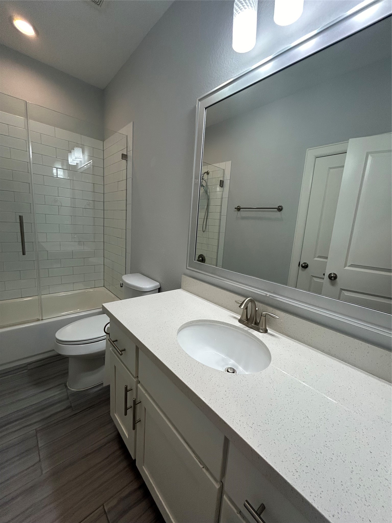 1211 Marconi Street Houston, TX 77019 - Photo 35 of 42 a bathroom with a double vanity sink toilet and shower