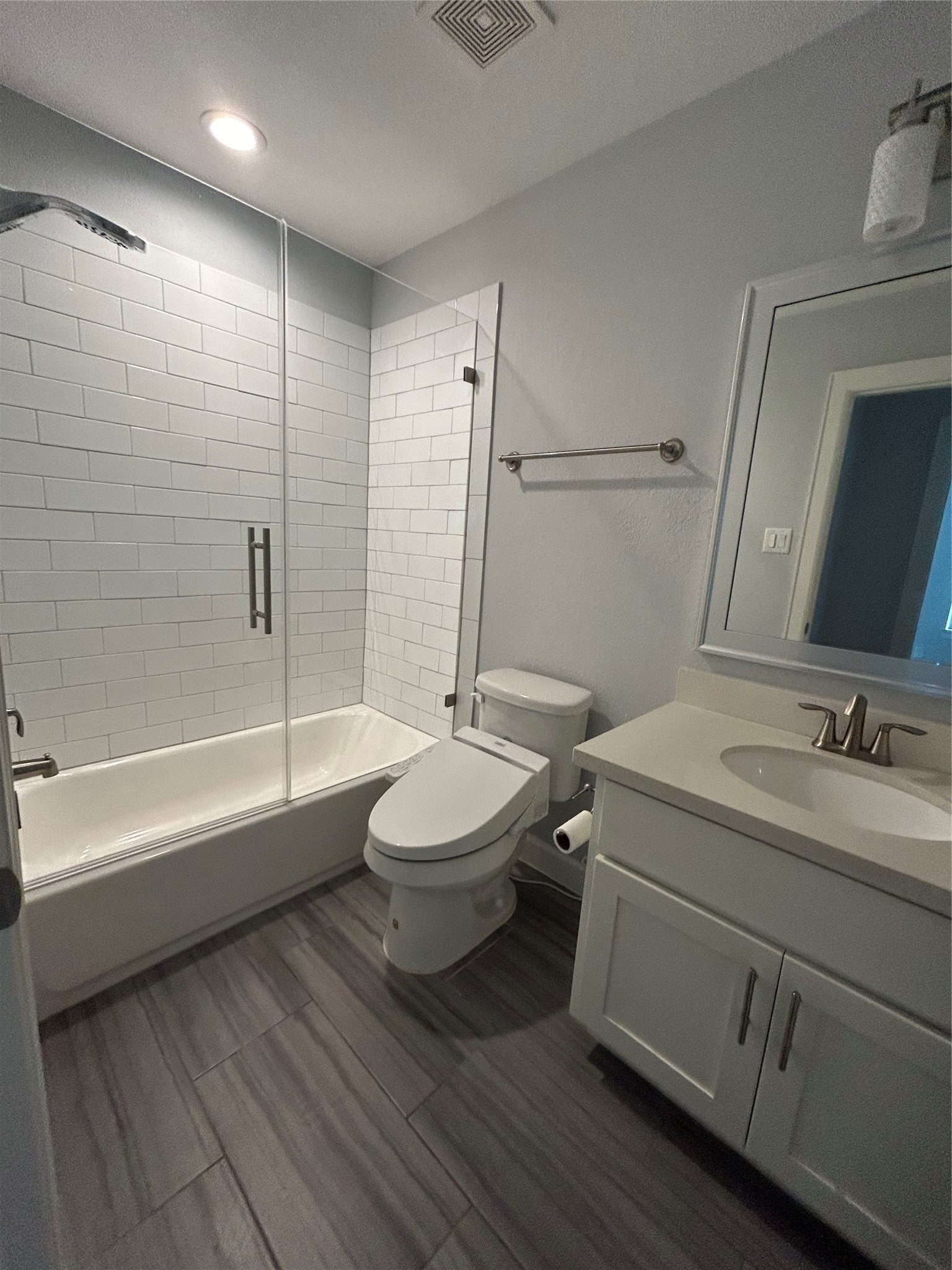 1211 Marconi Street Houston, TX 77019 - Photo 38 of 42 a bathroom with a toilet sink and mirror