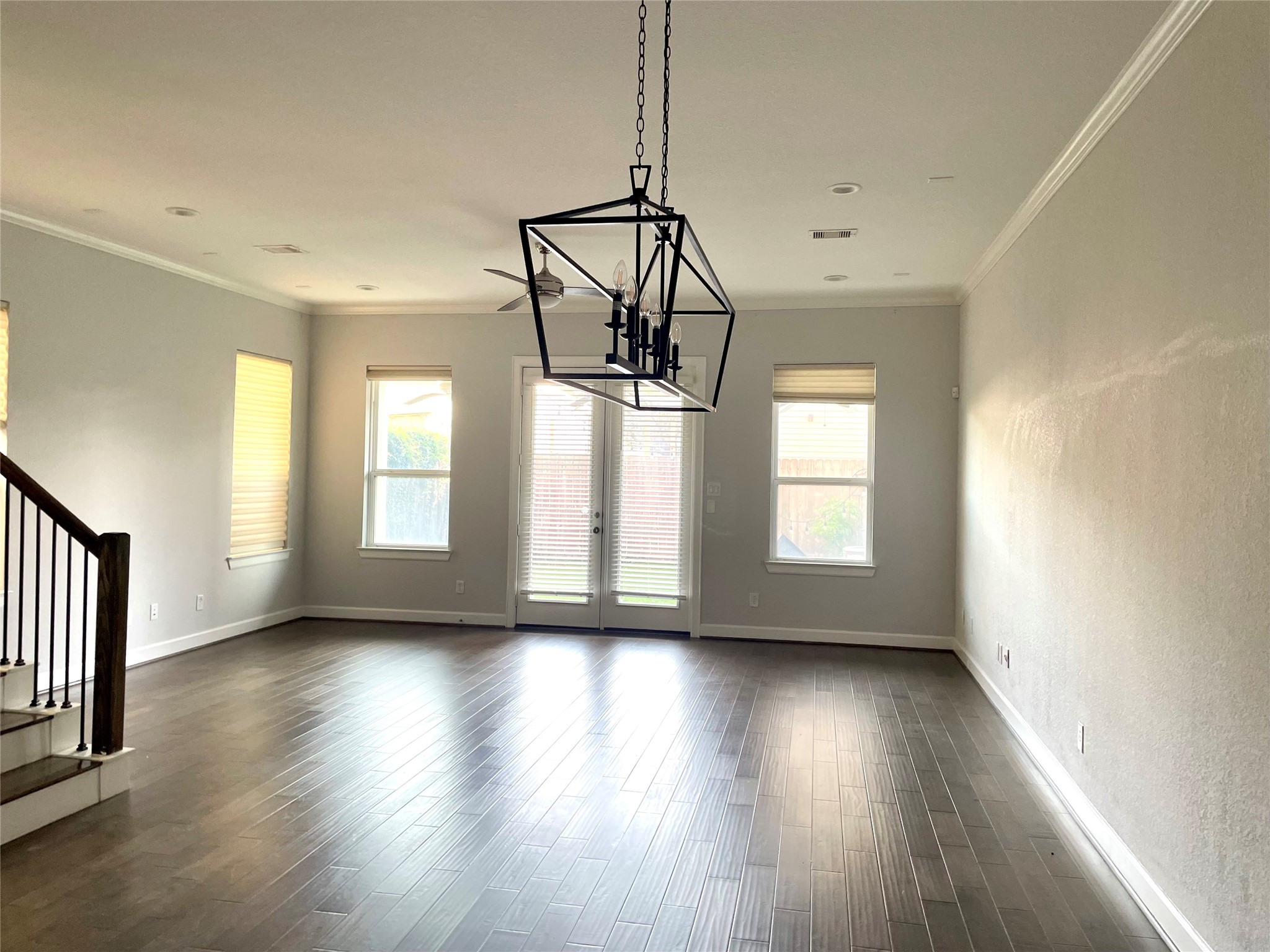 1211 Marconi Street Houston, TX 77019 - Photo 8 of 42 a view of an empty room with wooden floor fridge and a window