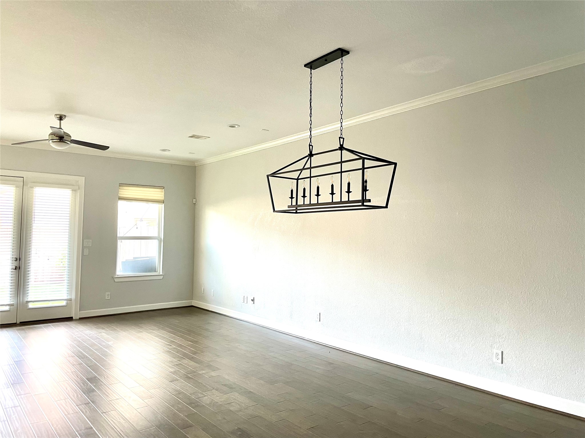 1211 Marconi Street Houston, TX 77019 - Photo 9 of 42 a view of a room with a window and wooden floor