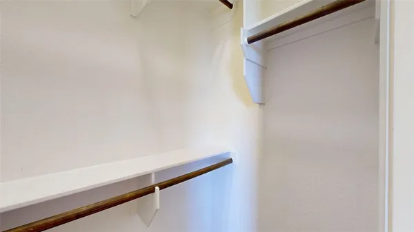 a bathroom with a sink vanity mirror and toilet