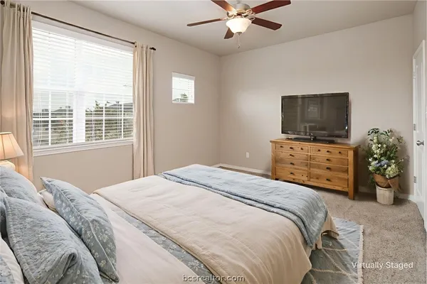 a bedroom with bed and a window