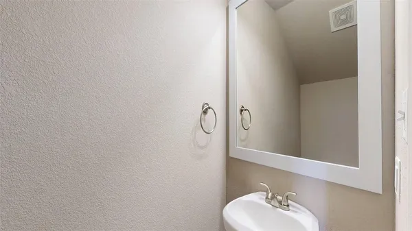 a bathroom with a sink and vanity