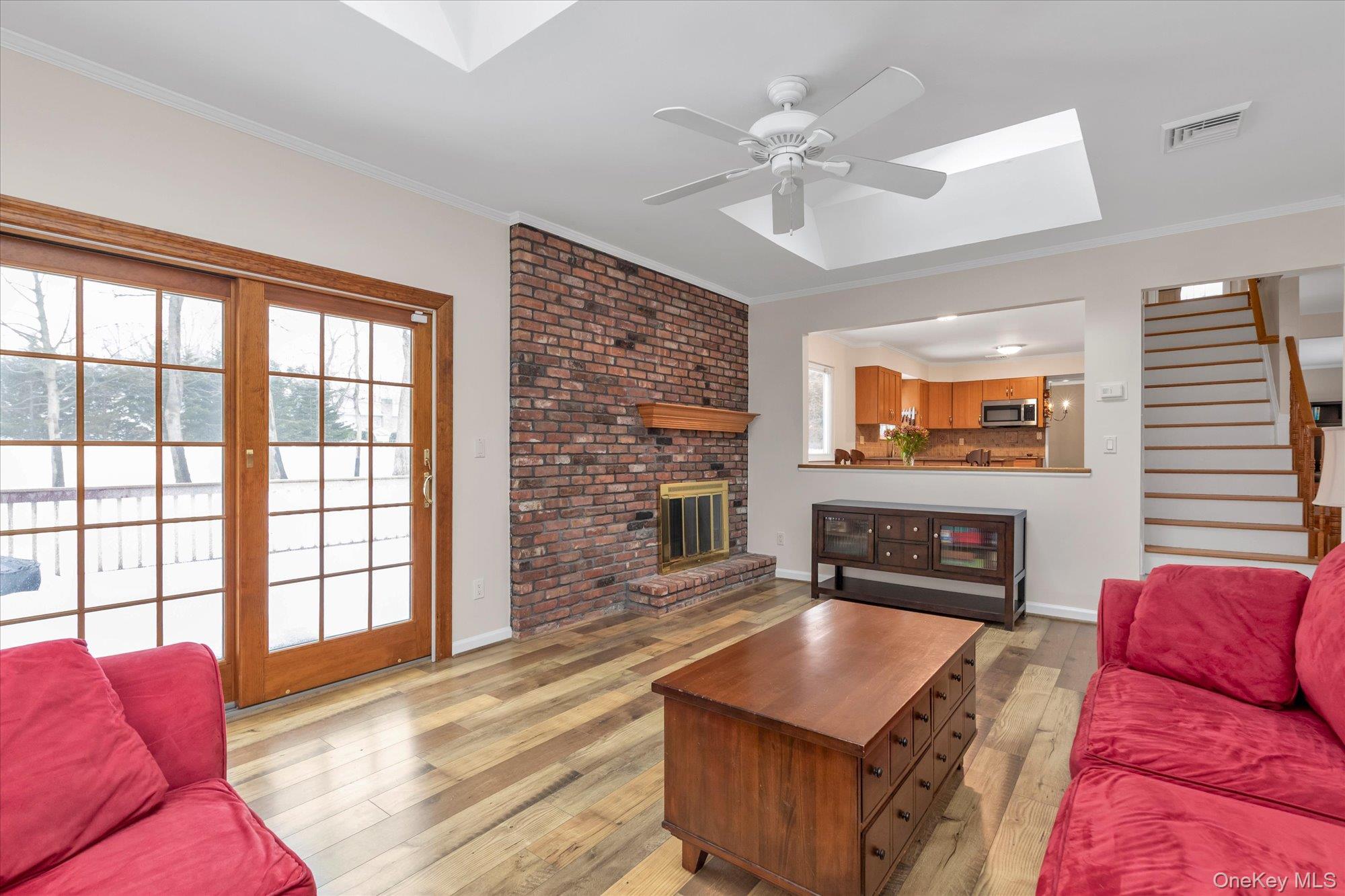 111 Cocks Lane Locust Valley, NY 11560 - Photo 12 of 23 a living room with furniture a flat screen tv and a fireplace
