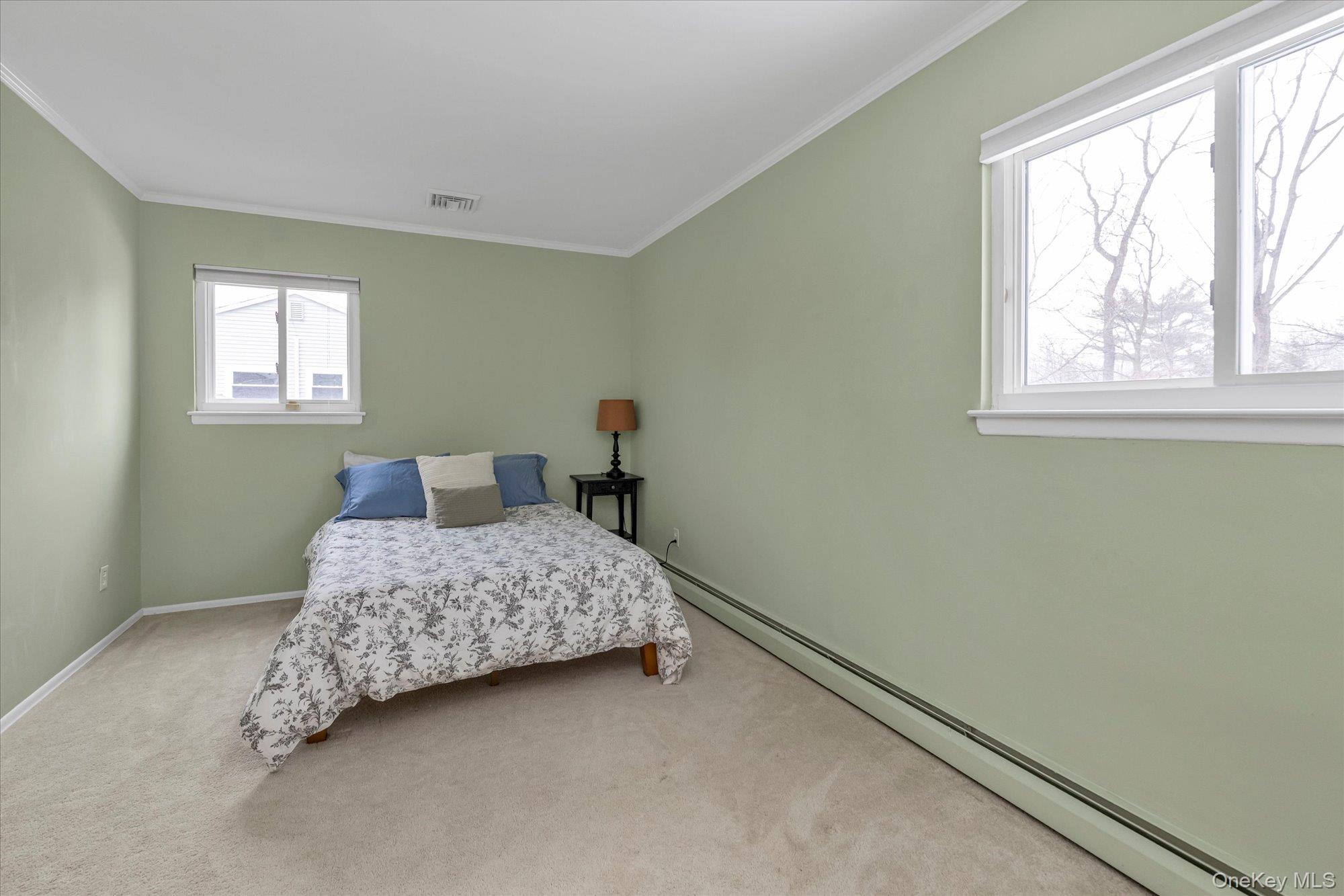 111 Cocks Lane Locust Valley, NY 11560 - Photo 17 of 23 a bedroom with a bed and window