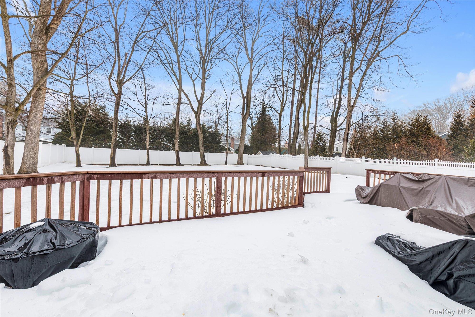 111 Cocks Lane Locust Valley, NY 11560 - Photo 21 of 23 a view of a roof deck with wooden fence and floor