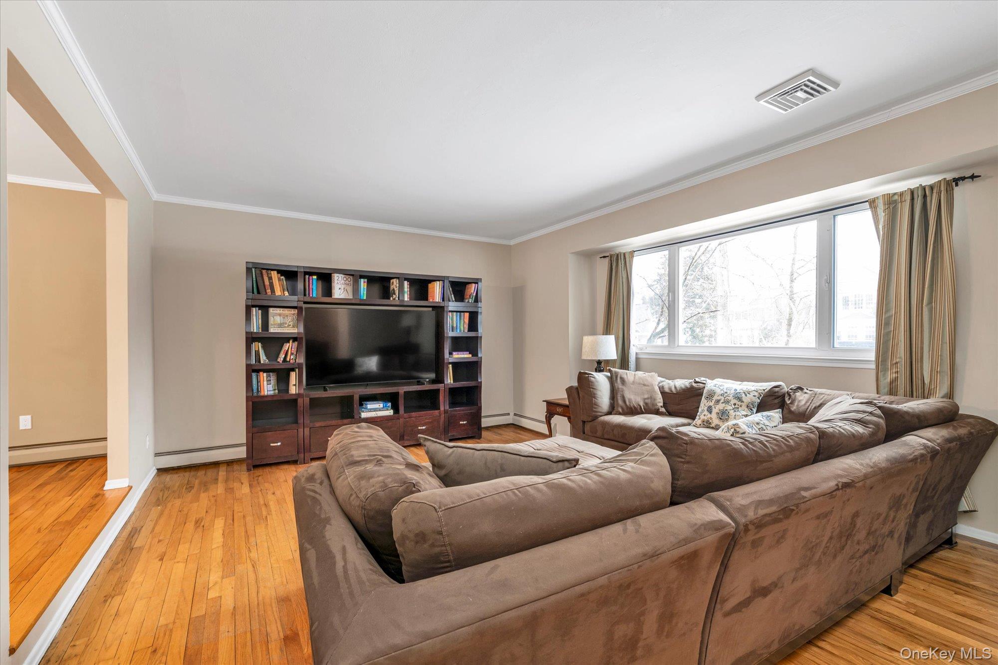 111 Cocks Lane Locust Valley, NY 11560 - Photo 3 of 23 a living room with furniture and a flat screen tv