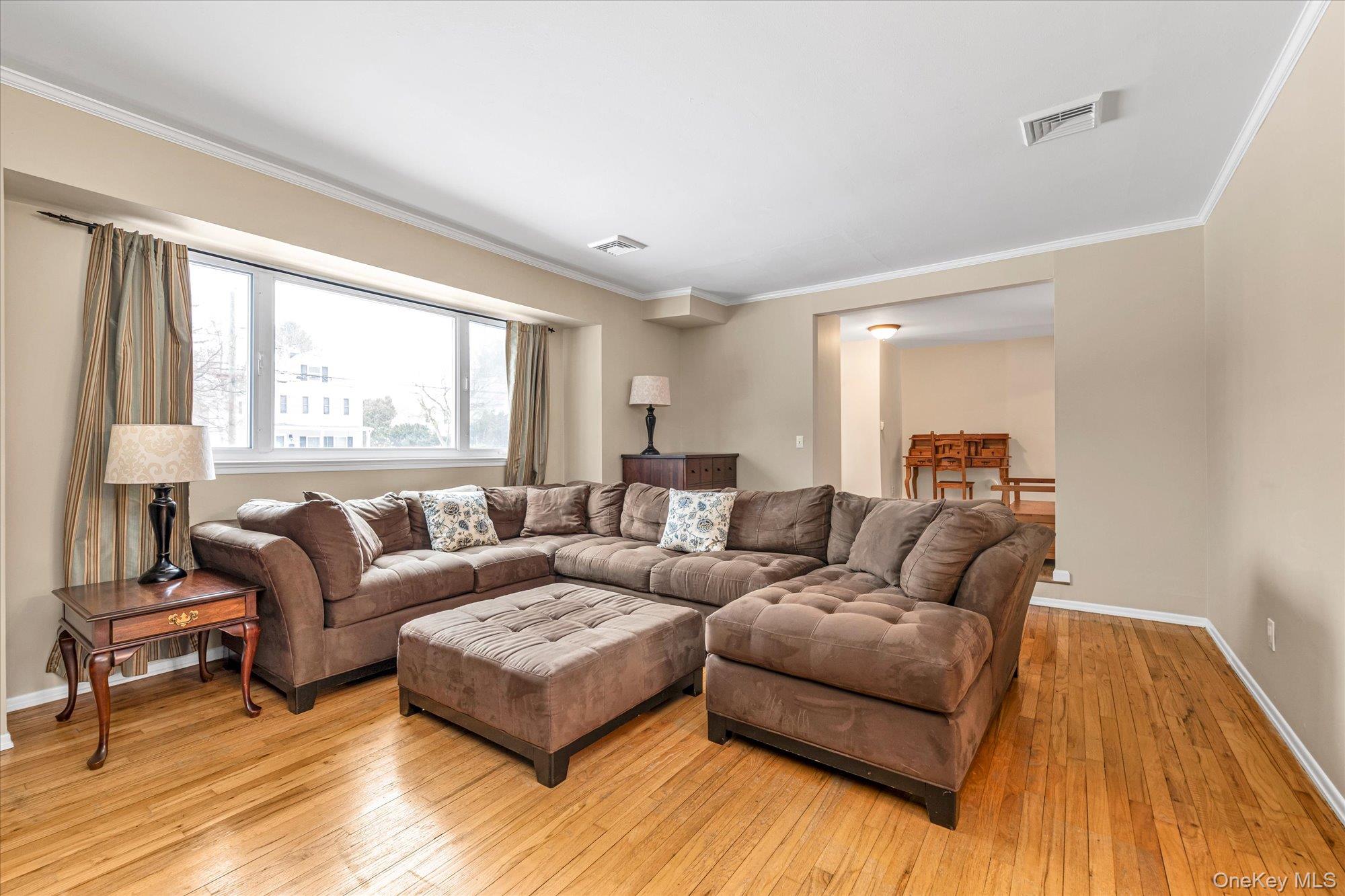 111 Cocks Lane Locust Valley, NY 11560 - Photo 5 of 23 a living room with furniture and a large window