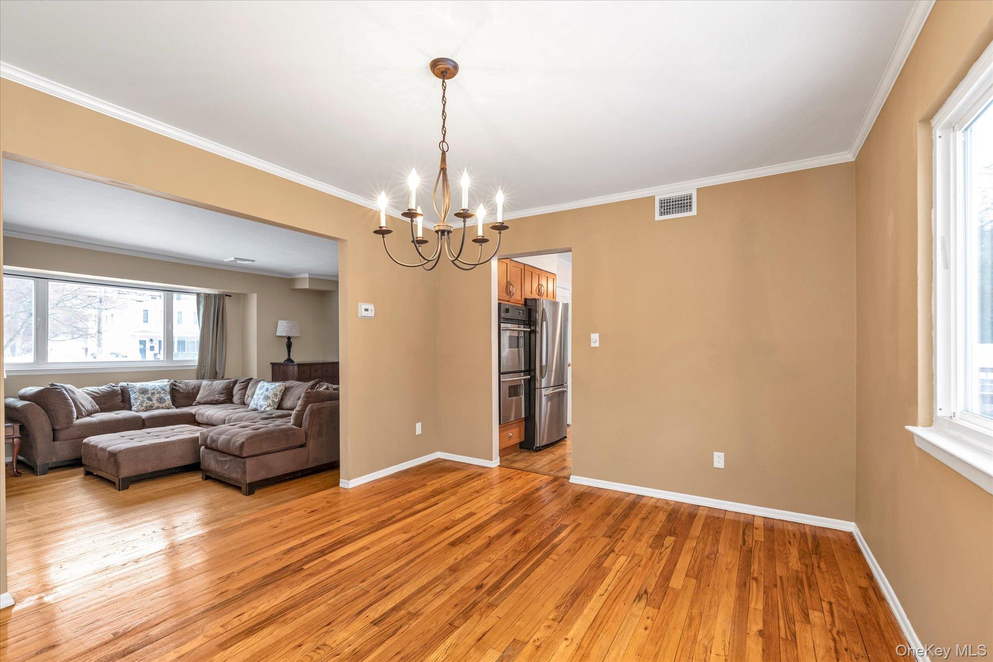 111 Cocks Lane Locust Valley, NY 11560 - Photo 6 of 23 a living room with furniture and a chandelier