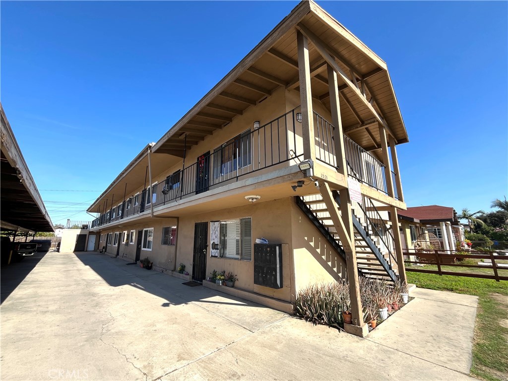 4329 East 55th Street, Unit E Maywood, CA 90270 - Photo 2 of 12 a view of a building with a balcony