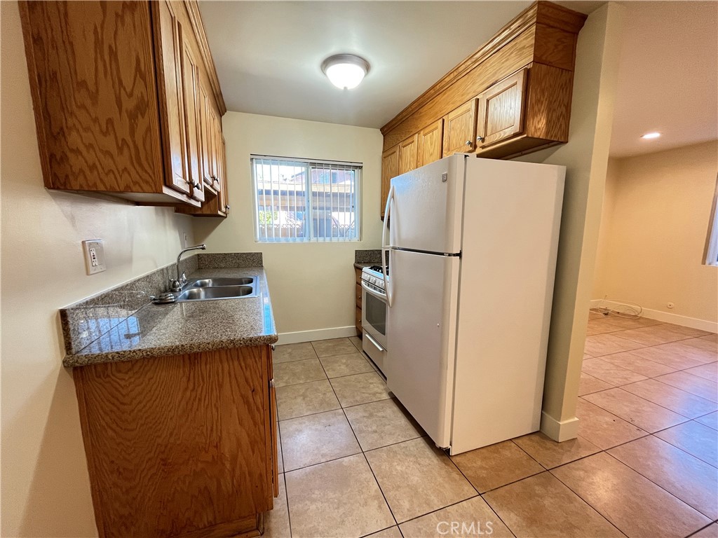 4329 East 55th Street, Unit E Maywood, CA 90270 - Photo 7 of 12 a view of a storage & utility room with washer and dryer