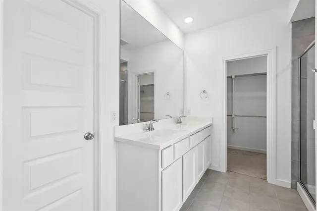 a bathroom with a sink a vanity and a mirror