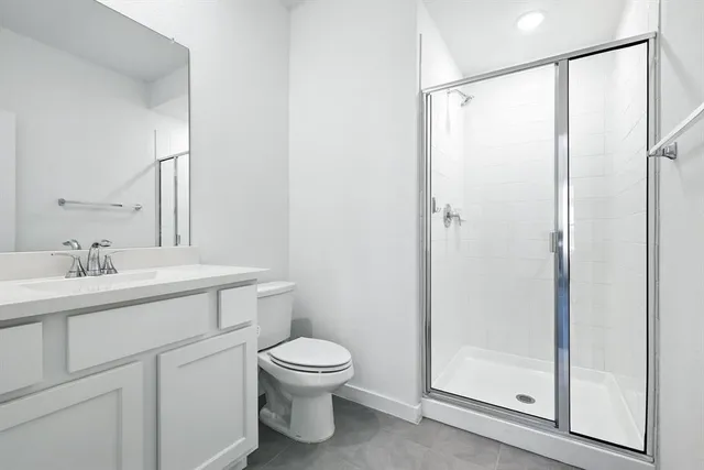 a bathroom with a toilet a sink and a mirror