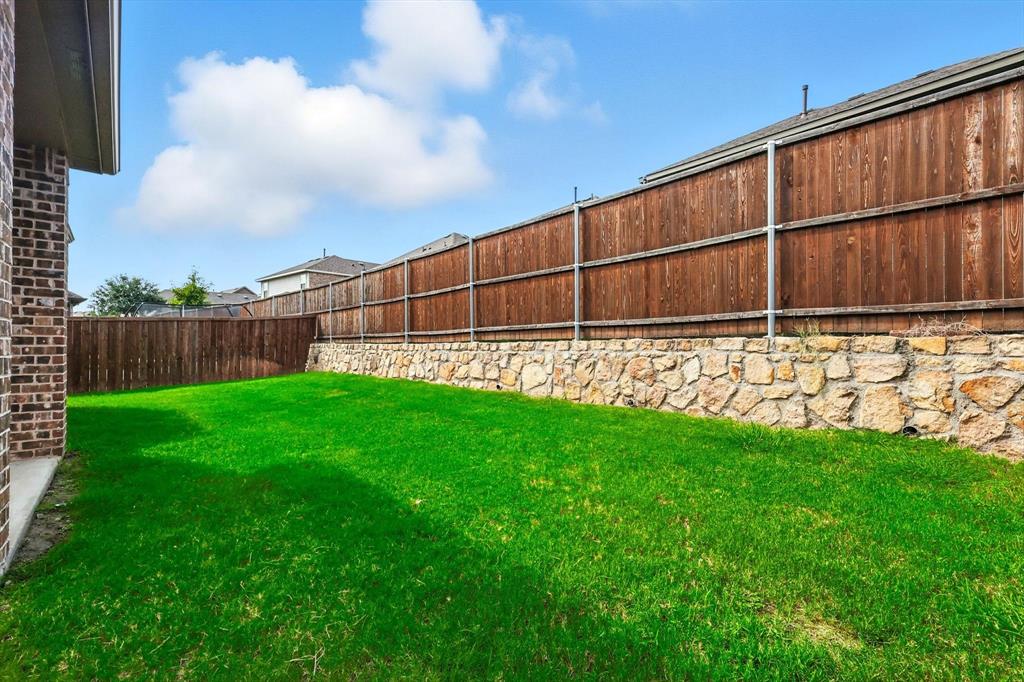 2328 Neff Lane Forney, TX 75126 - Photo 28 of 30 a view of a backyard with wooden fence