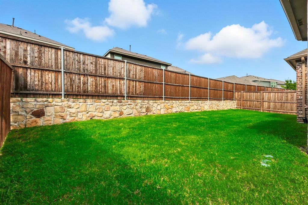 2328 Neff Lane Forney, TX 75126 - Photo 30 of 30 a backyard of a house with lots of green space and outdoor seating