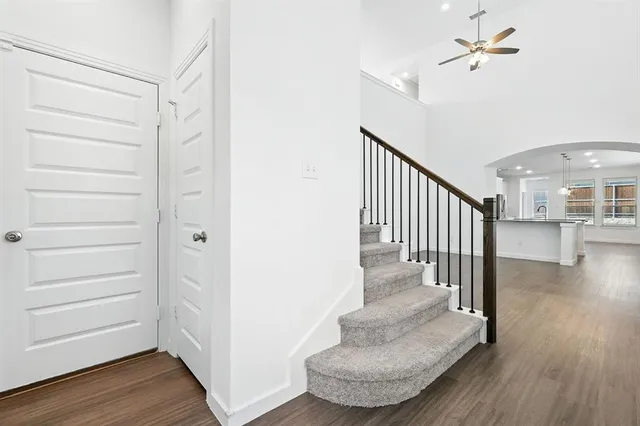 a view of entryway and hall with wooden floor