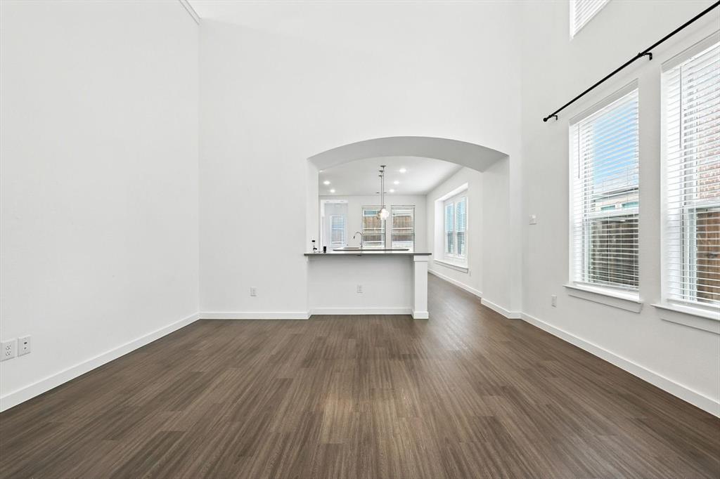 2328 Neff Lane Forney, TX 75126 - Photo 8 of 30 an empty room with wooden floor and windows