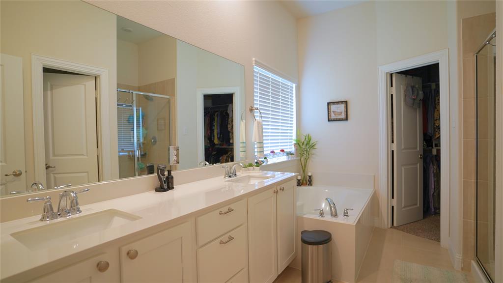 1101 Ginger Road Aubrey, TX 76227 - Photo 11 of 16 a bathroom with a double vanity sink mirror and toilet