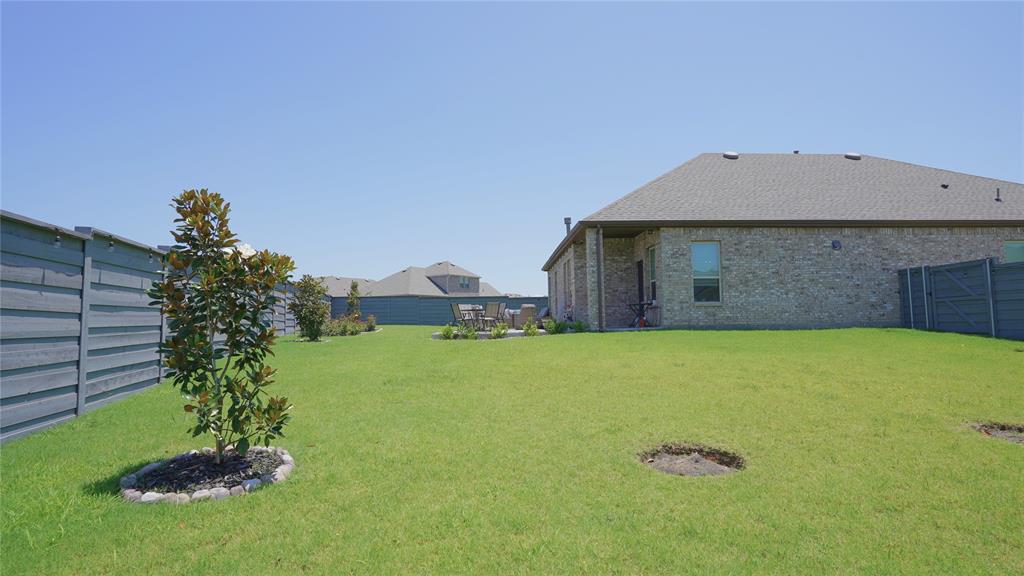1101 Ginger Road Aubrey, TX 76227 - Photo 15 of 16 a front view of a house with a yard
