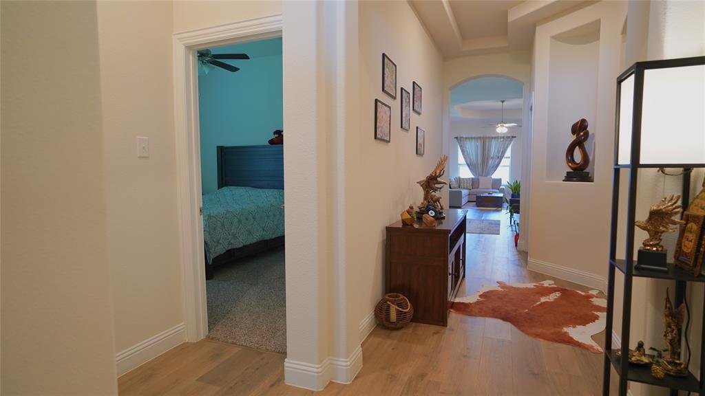 1101 Ginger Road Aubrey, TX 76227 - Photo 4 of 16 a view of hallway with livingroom and furniture