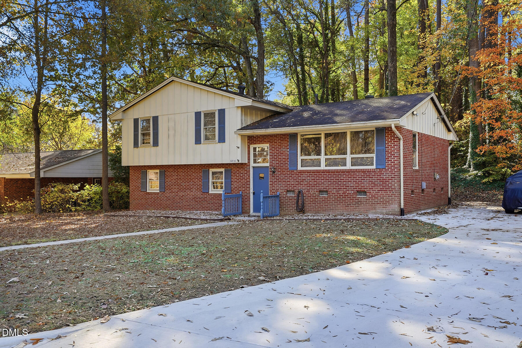3216 Broyhill Circle Raleigh, NC 27604 - Photo 1 of 32 a view of a yard in front of a house with large windows