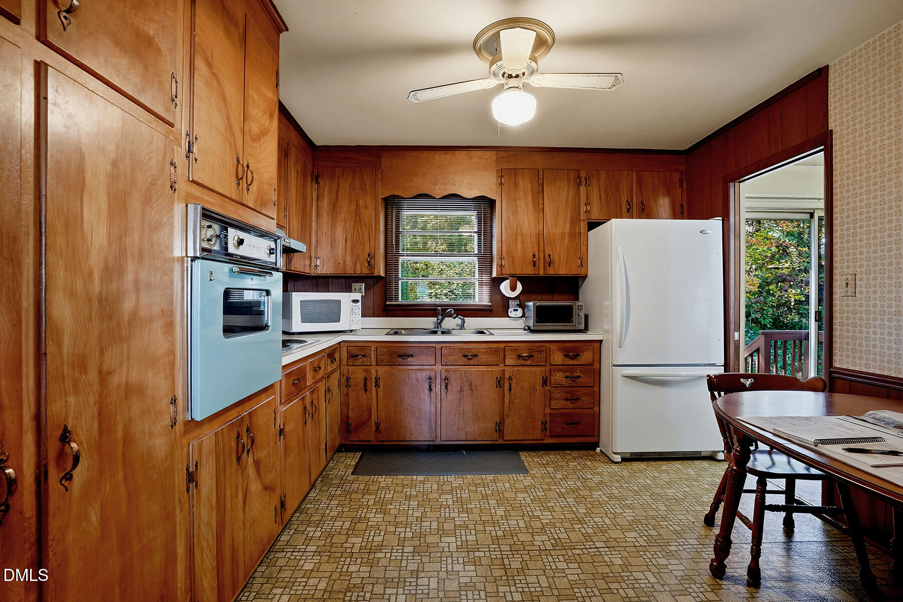 3216 Broyhill Circle Raleigh, NC 27604 - Photo 13 of 32 a kitchen with stainless steel appliances granite countertop a refrigerator a stove a sink dishwasher and a dining table with the kitchen view