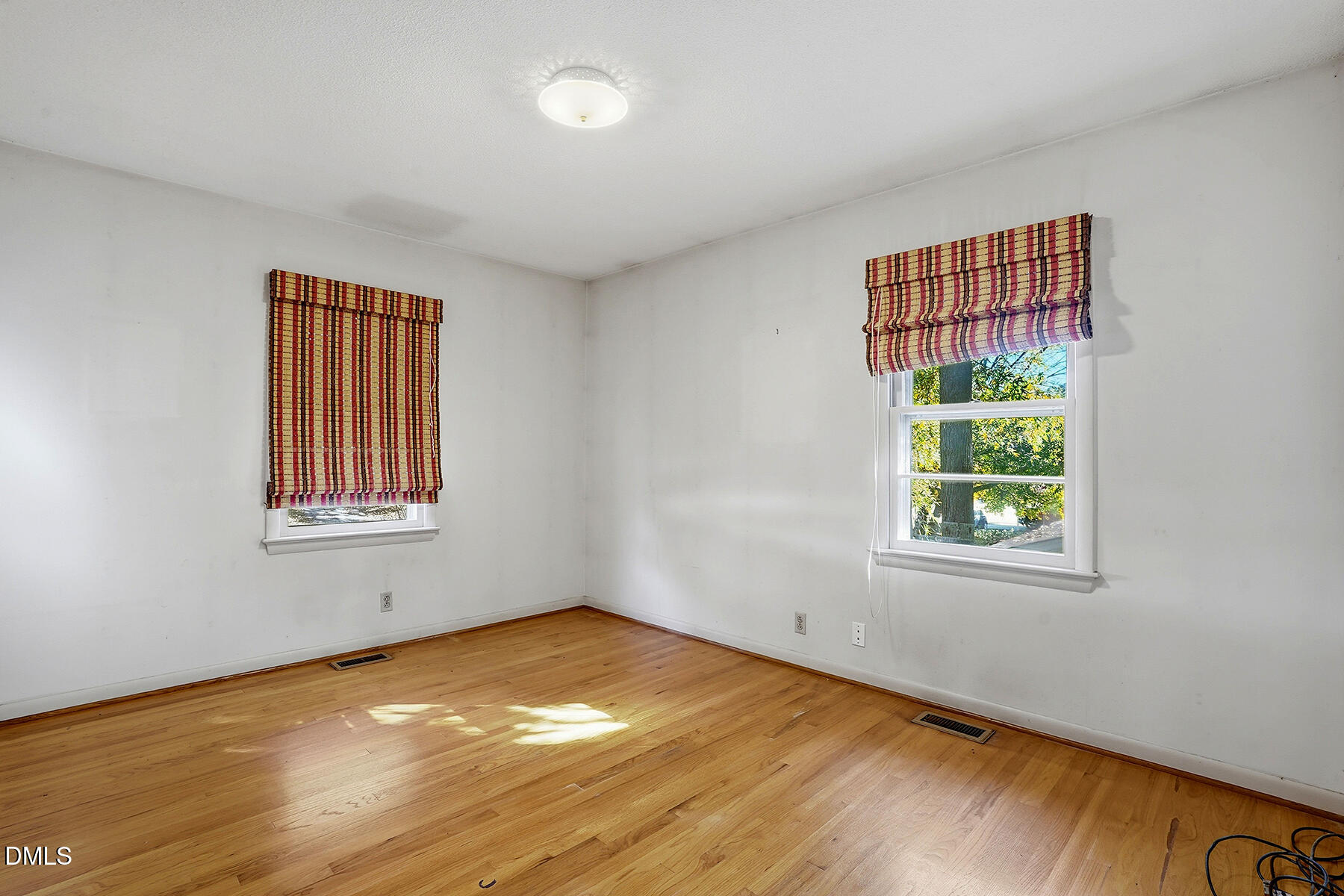 3216 Broyhill Circle Raleigh, NC 27604 - Photo 19 of 32 a view of an empty room with wooden floor and a window