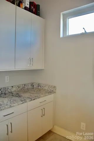 a view of a hallway and wooden floor