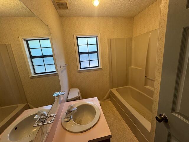 446 John King Road Crestview, FL 32539 - Photo 9 of 14 a bathroom with a sink a toilet and shower