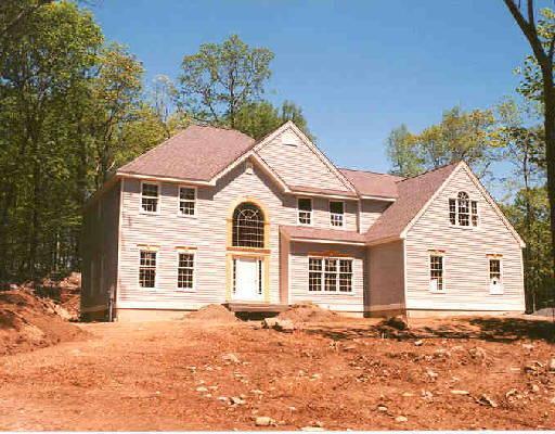 Lot102 Clapboard Ridge Sandy Hook, CT 06482 - Photo 1 of 1 a front view of a house with a yard
