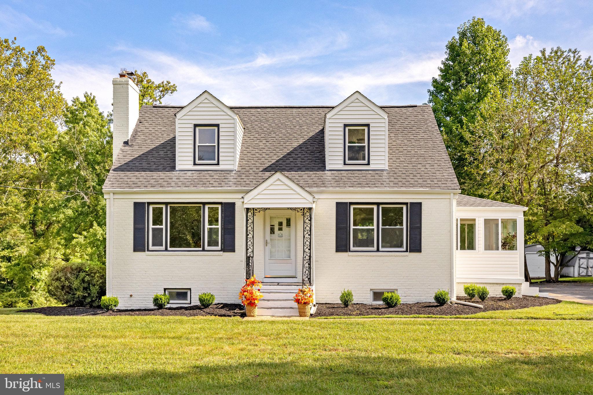 11410 Waples Mill Road Oakton, VA 22124 - Photo 2 of 62 Charming Cape Cod with lush greenery.