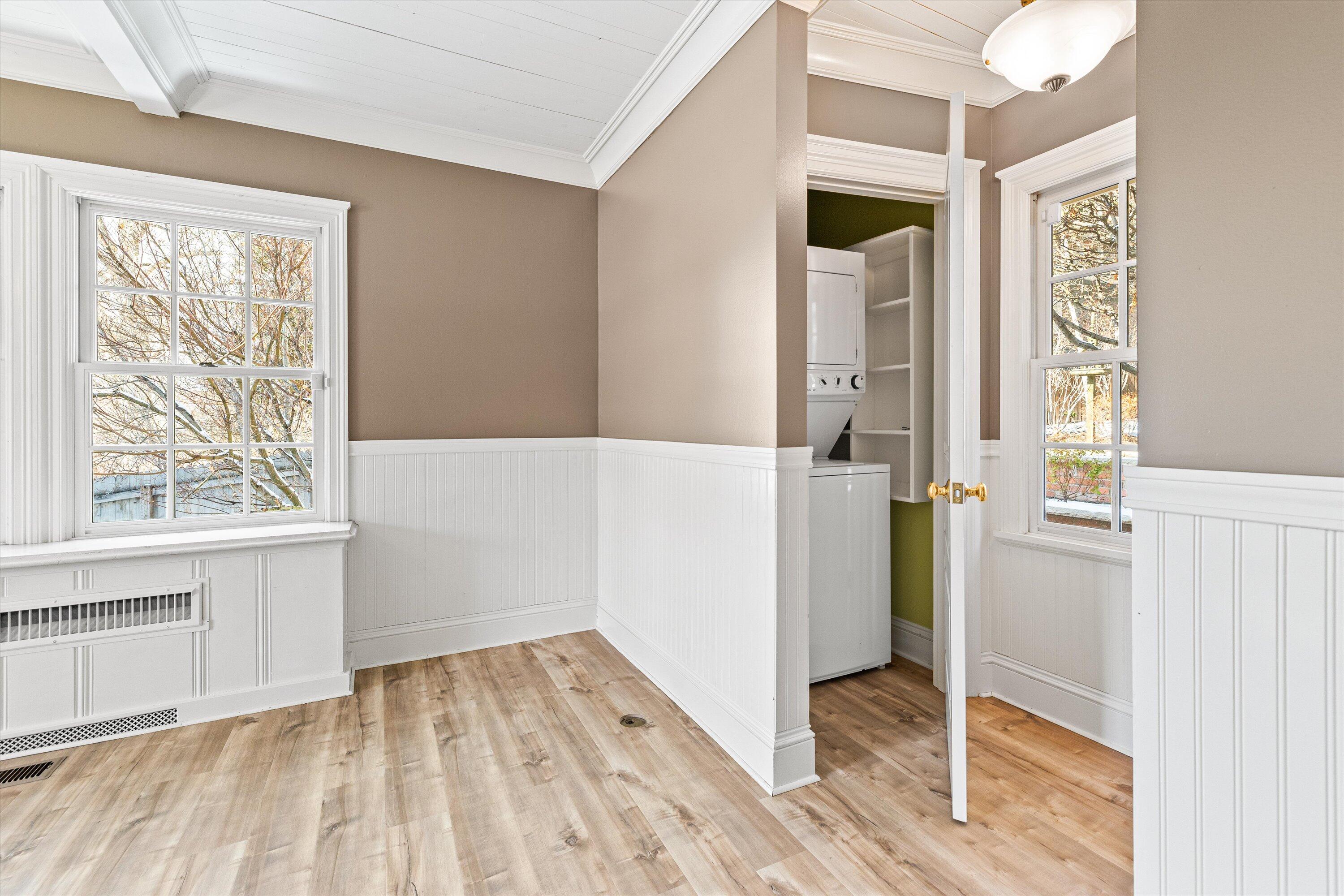 437 Northwest Drake Road Bend, OR 97703 - Photo 32 of 86 a view of hallway with wooden floor and front door