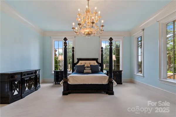 a large spacious bathroom with a granite countertop sink a large mirror and a bathtub with shower