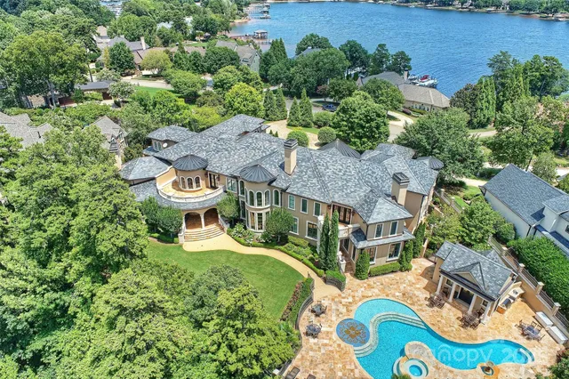 an aerial view of a house with outdoor space