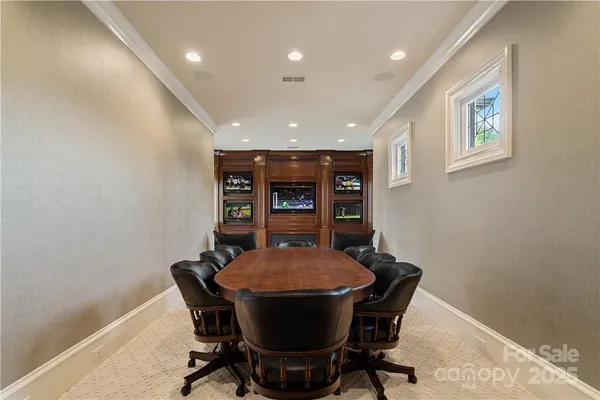 a bed room with a bed mirror and a window