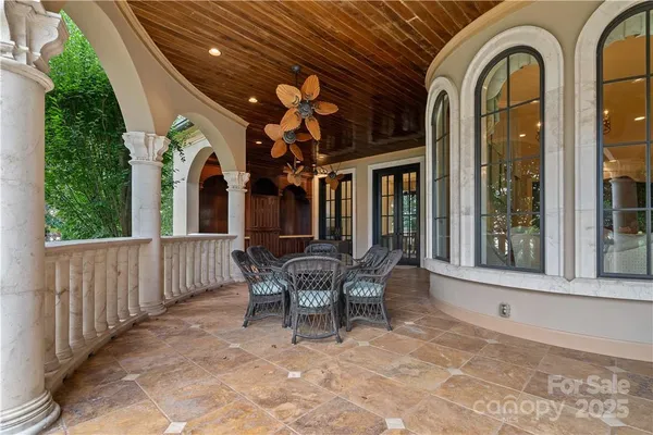 a front view of a house with a yard fountain