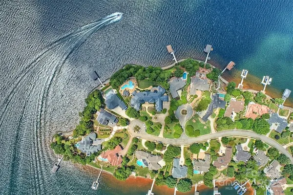 a front view of a house with a big yard