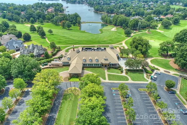 an aerial view of residential house with outdoor space and lake view