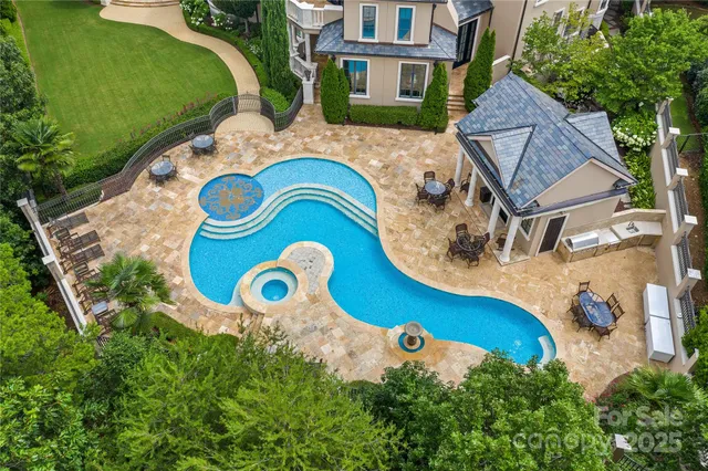 an aerial view of a house with garden space and street view