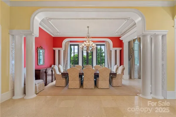 a kitchen with kitchen island granite countertop a stove and a view of living room