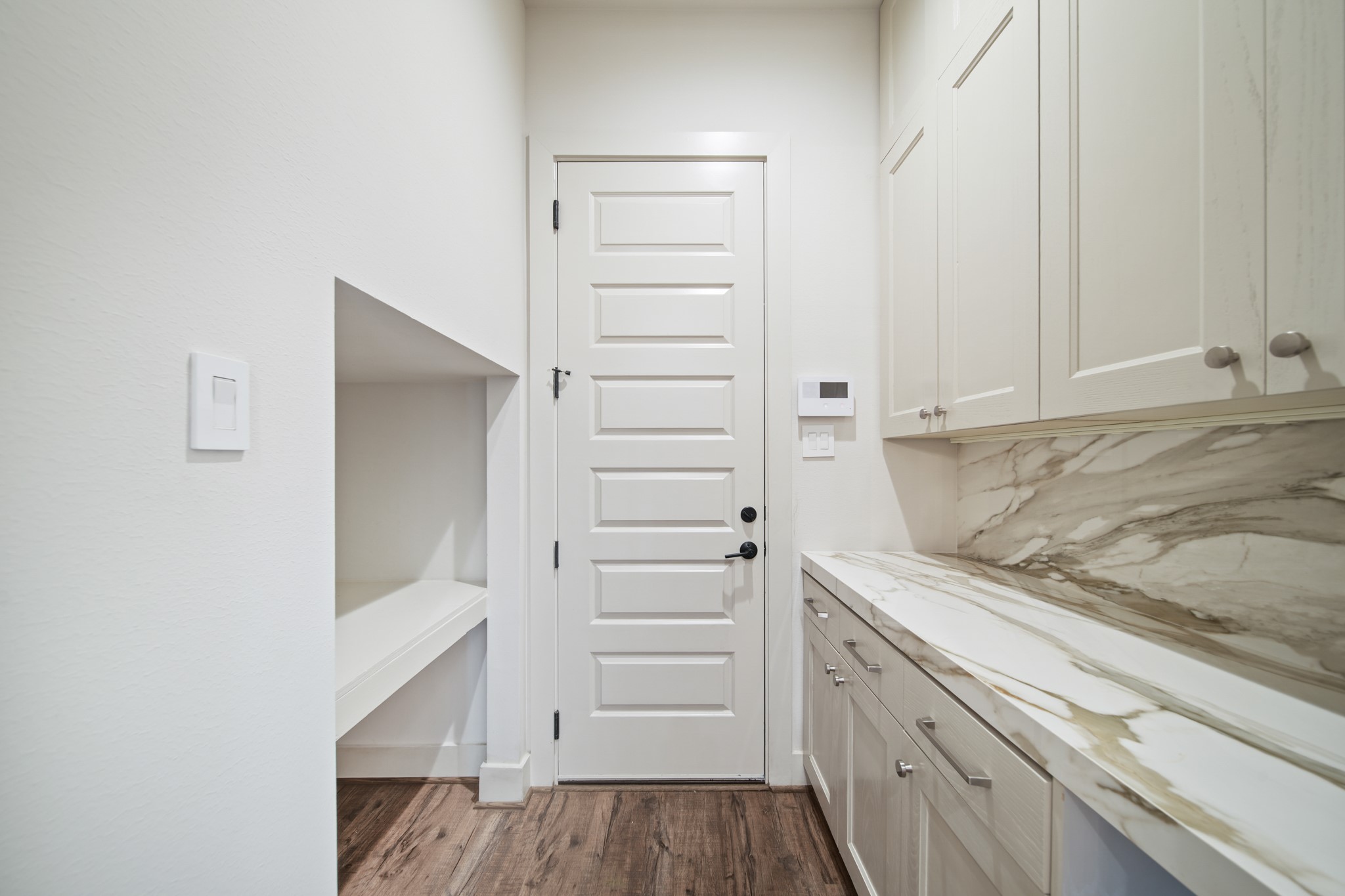 5434 Windswept Lane Houston, TX 77056 - Photo 16 of 45 A beautifully designed landing zone that seamlessly transitions into the home, enhanced by refined butler-pantry features for effortless organization.