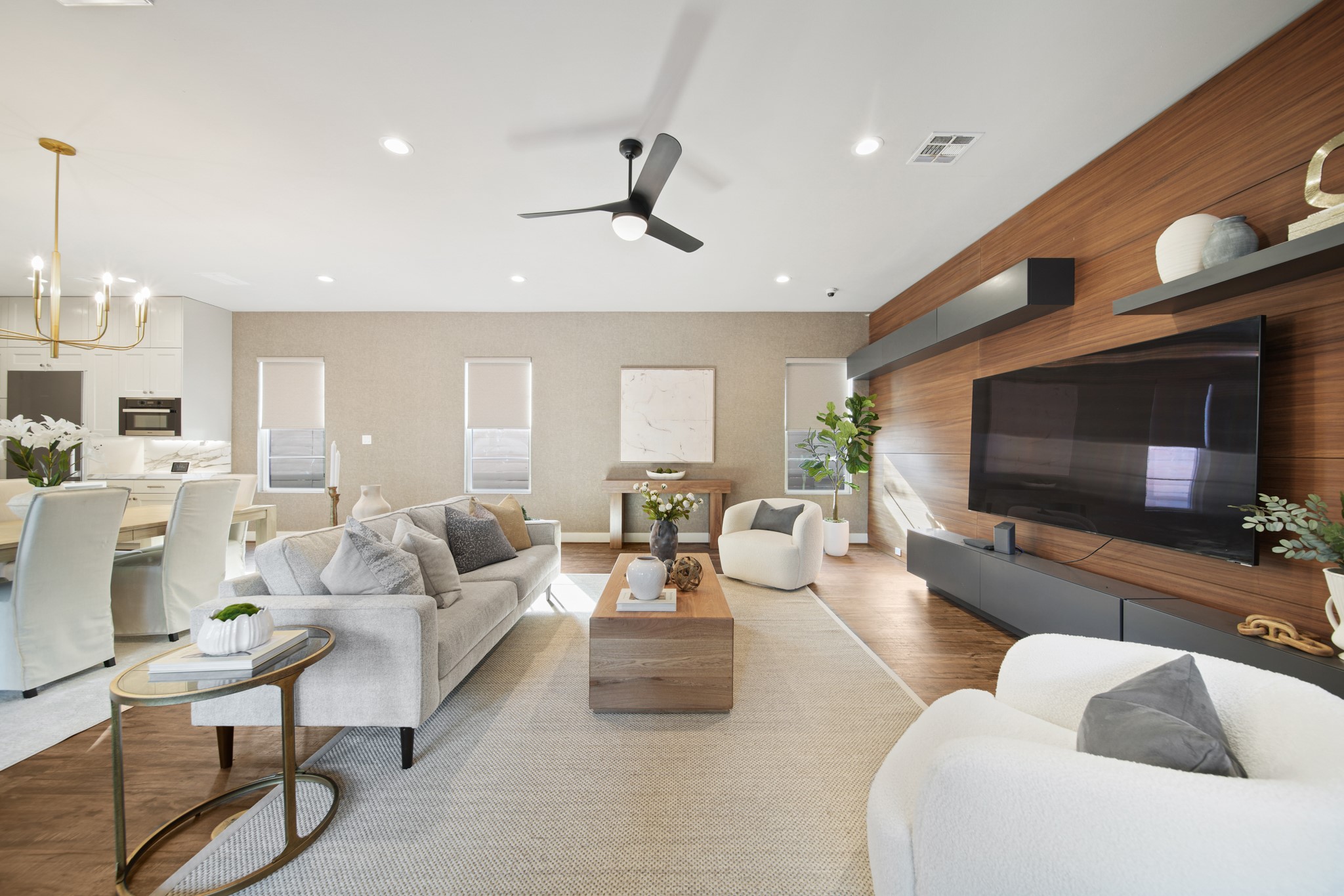 5434 Windswept Lane Houston, TX 77056 - Photo 19 of 45 The attractive living room features a ceiling fan, recessed lighting, and built-in shelves.