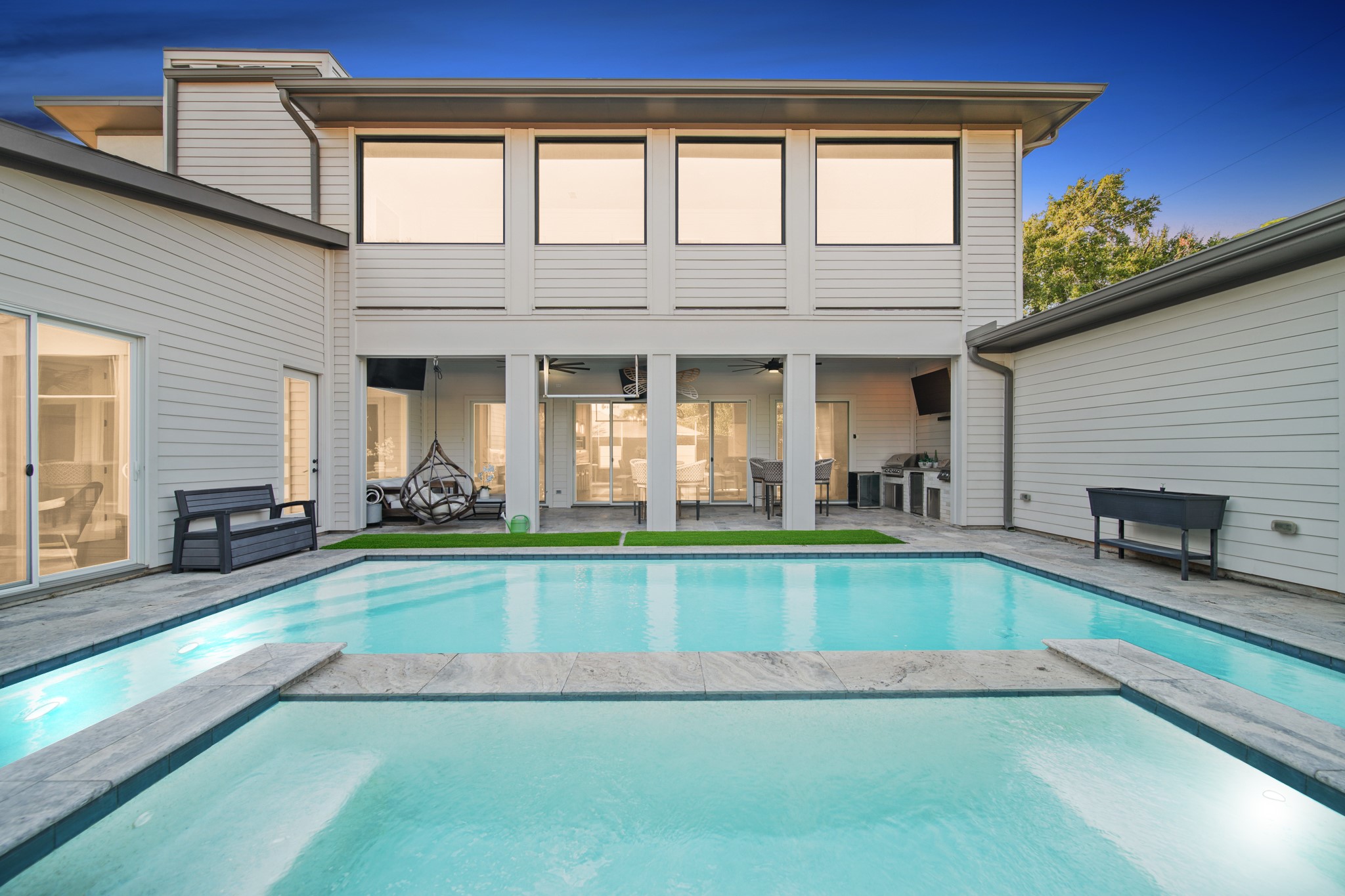 5434 Windswept Lane Houston, TX 77056 - Photo 2 of 45 A resort-inspired oasis at home, complete with a shimmering pool and spa for ultimate relaxation and refined outdoor living.