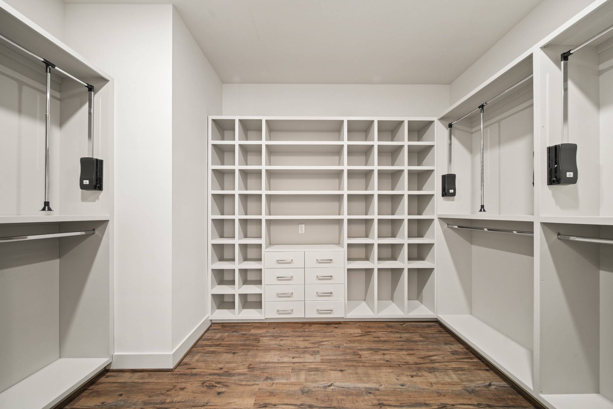 5434 Windswept Lane Houston, TX 77056 - Photo 25 of 45 Ample space in primary closet. Featuring hanging and drawer storage.