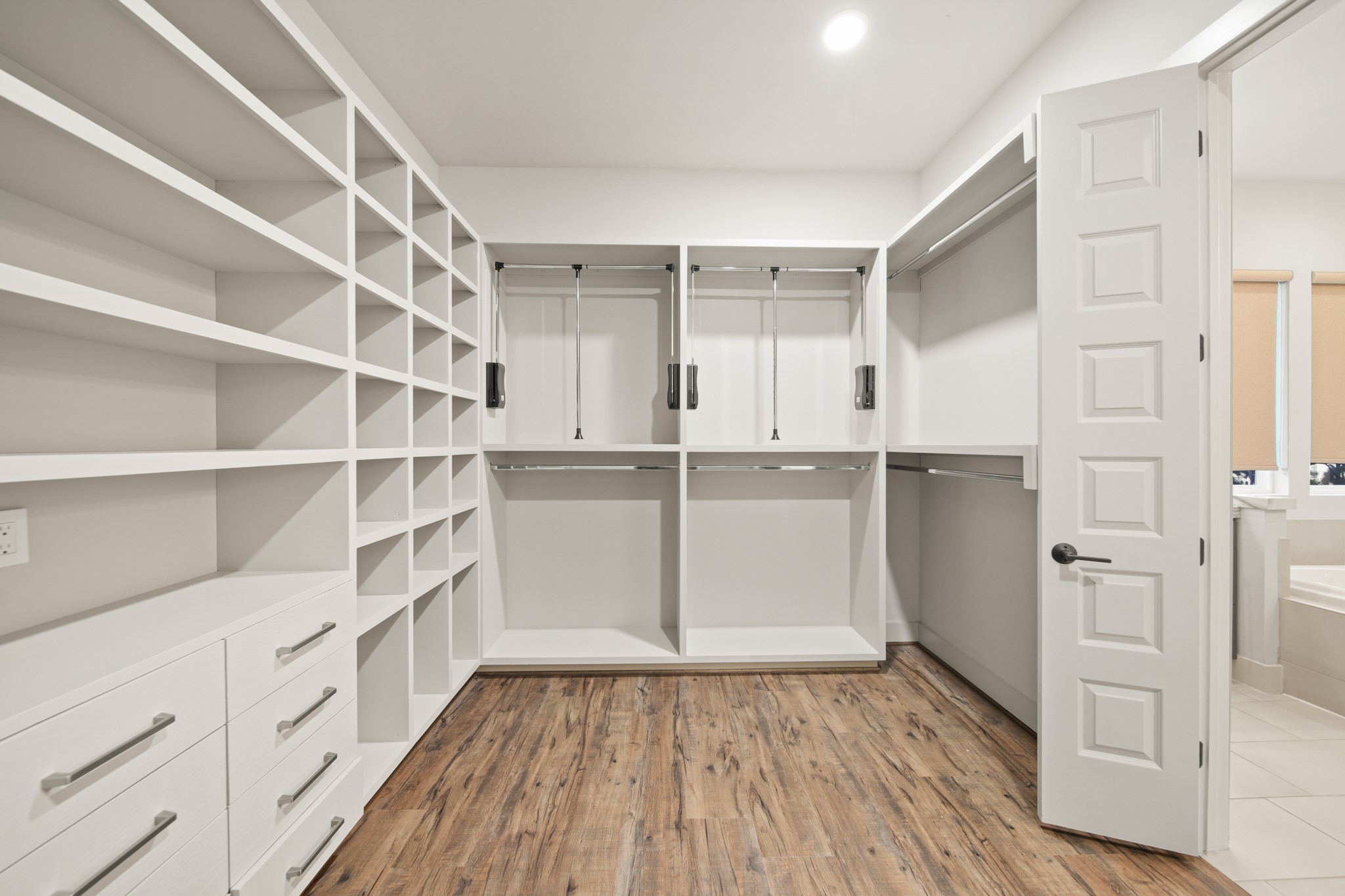 5434 Windswept Lane Houston, TX 77056 - Photo 26 of 45 Primary closet features hanging and drawer storage.