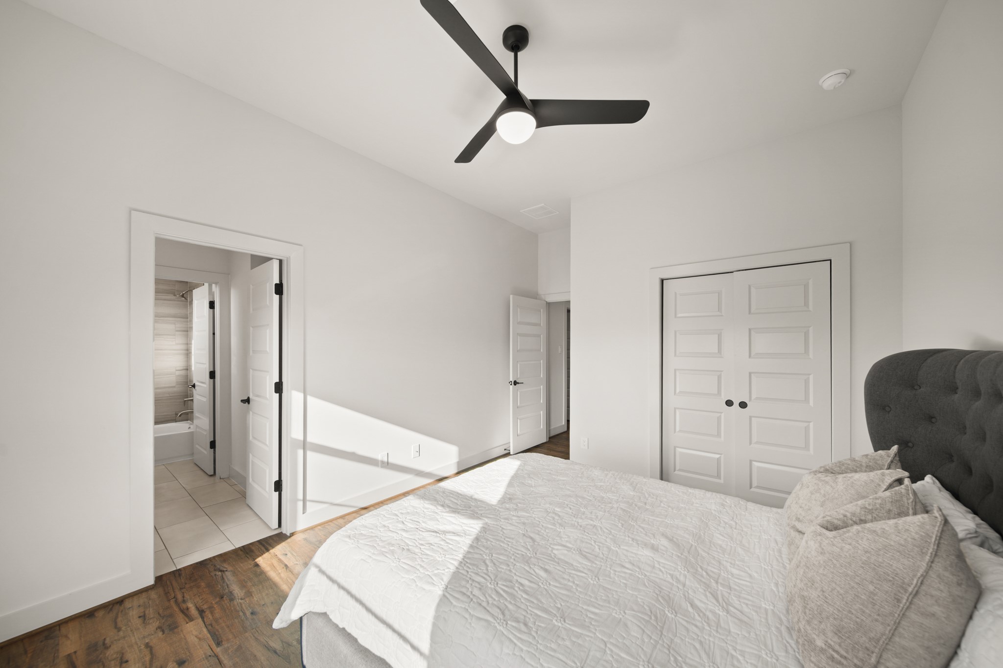 5434 Windswept Lane Houston, TX 77056 - Photo 37 of 45 This comfortable secondary bedroom includes a ceiling fan, a built-in closet and immediate access to the bathroom.