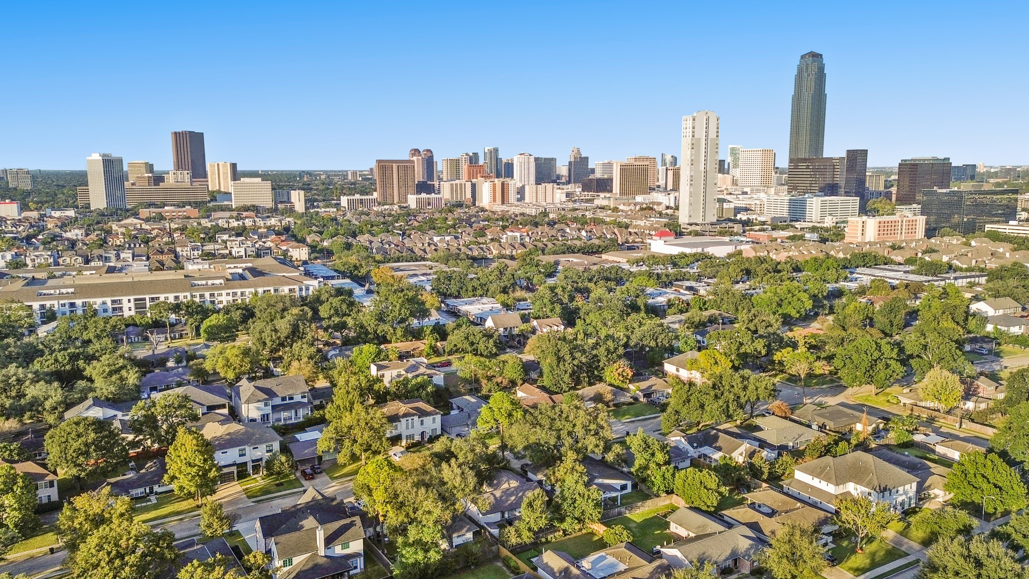 5434 Windswept Lane Houston, TX 77056 - Photo 4 of 45 Nestled in the heart of Larchmont, this 4,600+ sq. ft. residence features six bedrooms, four baths, and a heated pool — a true expression of elevated living.