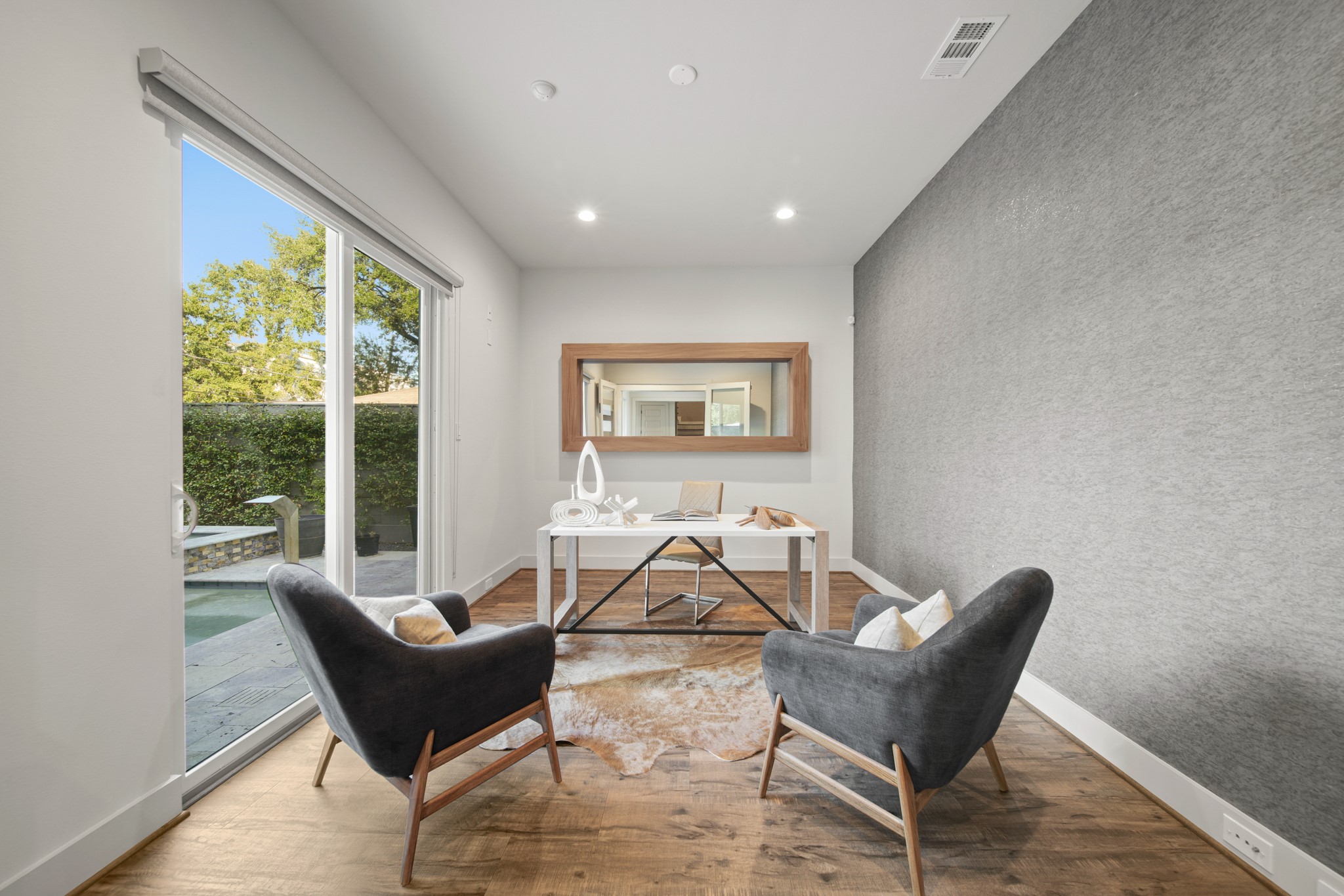 5434 Windswept Lane Houston, TX 77056 - Photo 7 of 45 Need a place to get your work done or where to host your private meetings? This office is very spacious, it has a sliding door, and your guests will be in awe with the views of the pool & spa in the backyard.