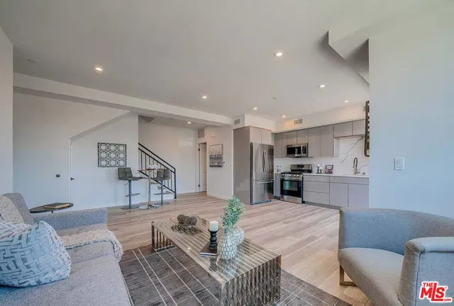 a view of a kitchen counter space and sink