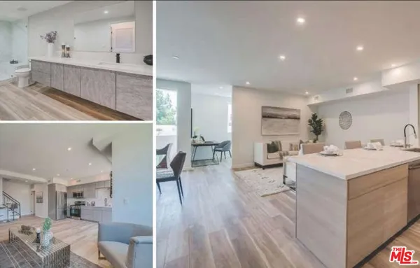 a kitchen with stainless steel appliances a refrigerator stove and sink